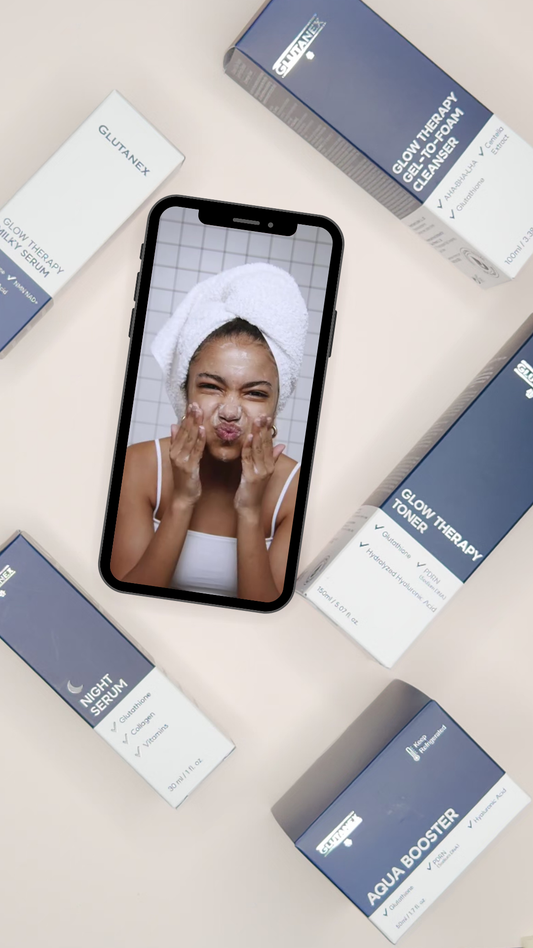 Glutanex skincare products arranged around smartphone showing cleansing routine, highlighting glutathione-based skincare system