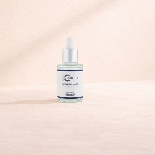 Curenex Daily Care Skin Booster serum bottle with dropper on a gradient beige background.