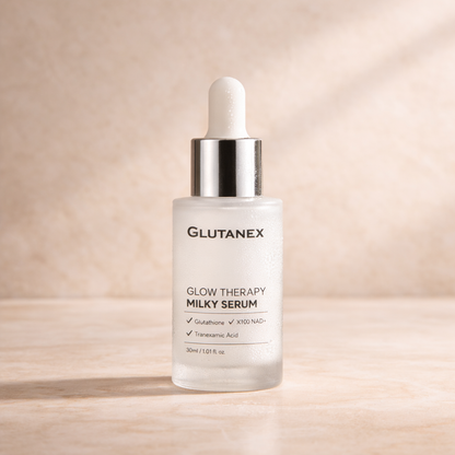 Glutanex Glow Therapy Milky Serum bottle on a beige background
