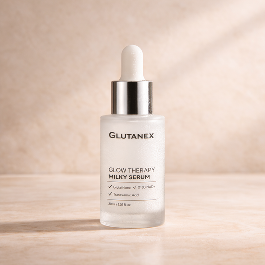 Glutanex Glow Therapy Milky Serum bottle on a beige background
