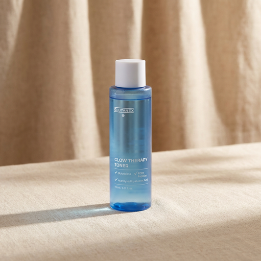 Blue bottle of Glutanex Glow Therapy Toner on a beige fabric background.
