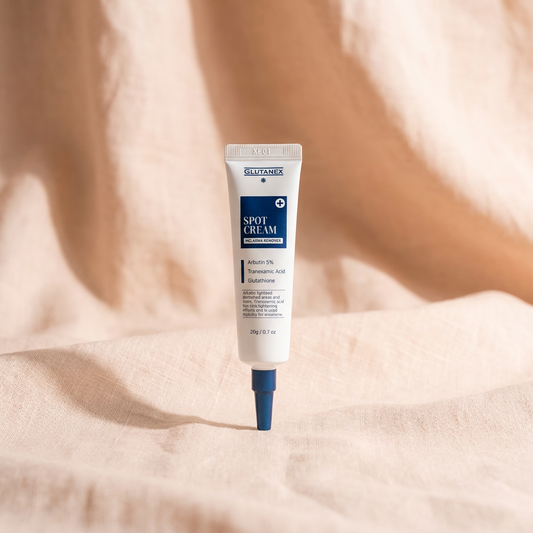 Tube of Glutanex Spot Cream on a beige fabric background.