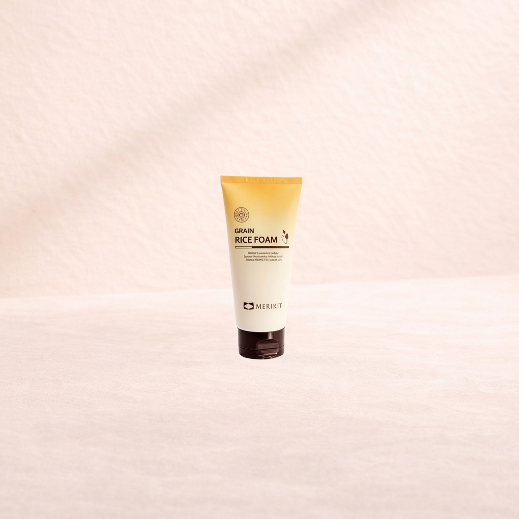 Tube of Merikit Grain Rice Foam on a beige background.