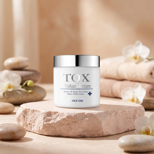 Ronas Tox Volume Cream jar on a stone surface with orchids and stones in the background.